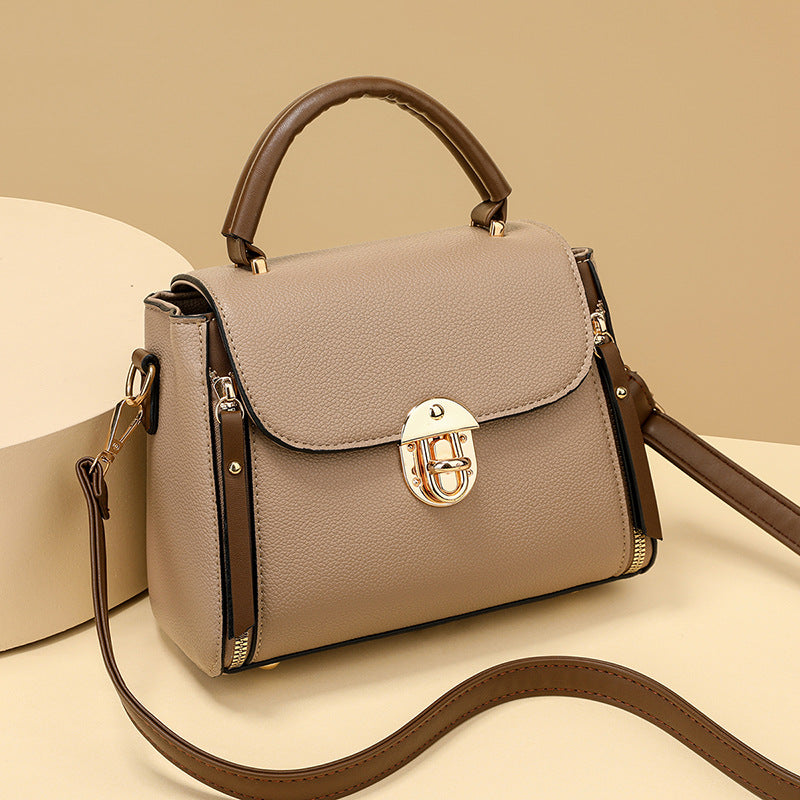 A large-capacity hand-held crossbody bag with a lock