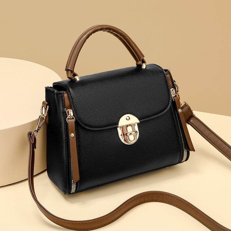 A large-capacity hand-held crossbody bag with a lock